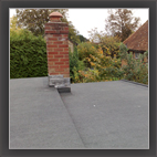 Torch-on felt roof with chimney detail