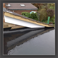 Flat felt roof installation in progress