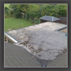 Damaged flat roof before